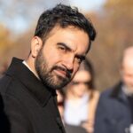 Socialist Mayor BLOWS Deadline — Catastrophic $5 Billion Hole… A man with a beard looking towards the camera at an outdoor event