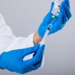 FDA Scandal: SECRET Memo Sparks Vaccine Uproar… A healthcare professional preparing a syringe with a vaccine