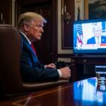 Trump’s Fed Overhaul: NEW Radical Plan… A political figure seated in the Oval Office, watching a television broadcast