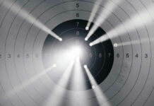 Prosecutor’s TROPHY Case TARGETS CELEBRITY Target with multiple bullet holes and light rays.