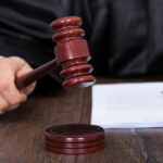 DEVASTATING — Judge KNEECAPS Border Controls Judge striking gavel near documents and pen.
