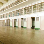 Army Revives Death Row Playbook Empty prison cells in a hallway.