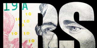 Close-up of a banknote featuring the letters IRS