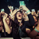 Locked-Down Wedding Stuns Madison Square Garden Concert crowd cheering and taking photos with phones.