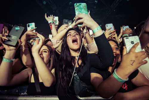 barcelona-mar-9-fans-of-one-direction-band Concert crowd cheering and taking photos with phones.