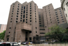 Suspends Sentence: Court Convicts Teen of Attempted Murder Tall concrete building with numerous windows and adjacent parked cars.