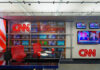 CNN World Headquarters studio with empty red chairs.