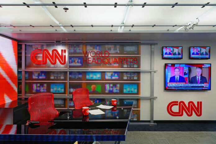 shutterstock_1284301780 CNN World Headquarters studio with empty red chairs.