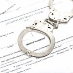 Florida Tests New Death Penalty Law in Murder Case Handcuffs on an arrest warrant document