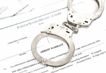 Florida Tests New Death Penalty Law in Murder Case Handcuffs on an arrest warrant document
