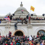 Trump Reportedly Fumed Over Half-Empty Rally Crowd at U.S. Capitol building with flags and cameras.