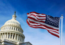 merica’s Patriotism Debate Just Got a Powerful New Voice U.S. Capitol building with waving American flag.