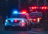 Highway Birth Ends Safely After Quick Police vehicle and ambulance with flashing lights at night
