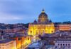 Illuminated St. Peter's Basilica in Rome at dusk