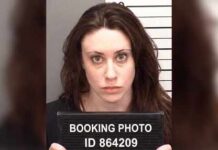 Ohio ‘House of Horrors’ Case Shifts to Courtroom Mugshot of a woman holding a booking sign