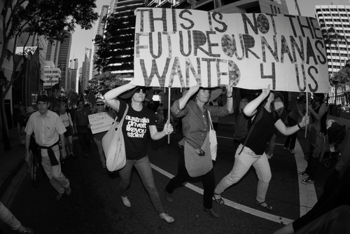 Protesters holding sign This is not the future our nanas wanted.